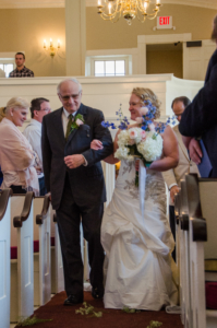 "Who gives this bride away?" One very delighted father, that's who!